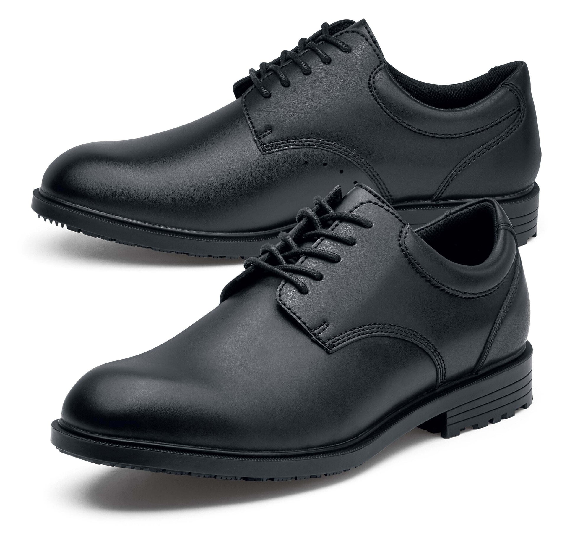 The Shoes for Crews Cambridge III is a slip-resistant leather dress shoe, with removable cushioned insoles and a padded comfort collar, pair seen from the left, emphasising the toe of the left shoe.