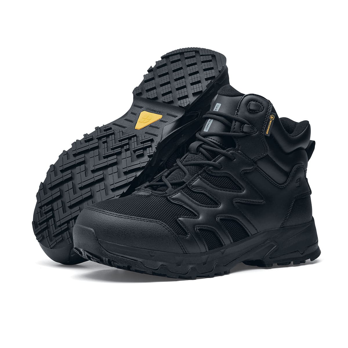 The Shoes for Crews Carrig Mid is a slip-resistant safety boot with a waterproof upper, pair seen on the left side and on the sole.