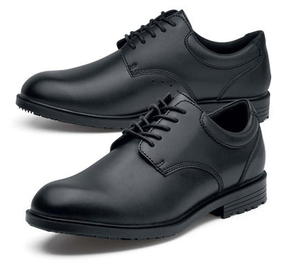 The Shoes for Crews Cambridge III is a slip-resistant leather dress shoe, with removable cushioned insoles and a padded comfort collar, pair seen from the left, emphasising the toe of the left shoe.