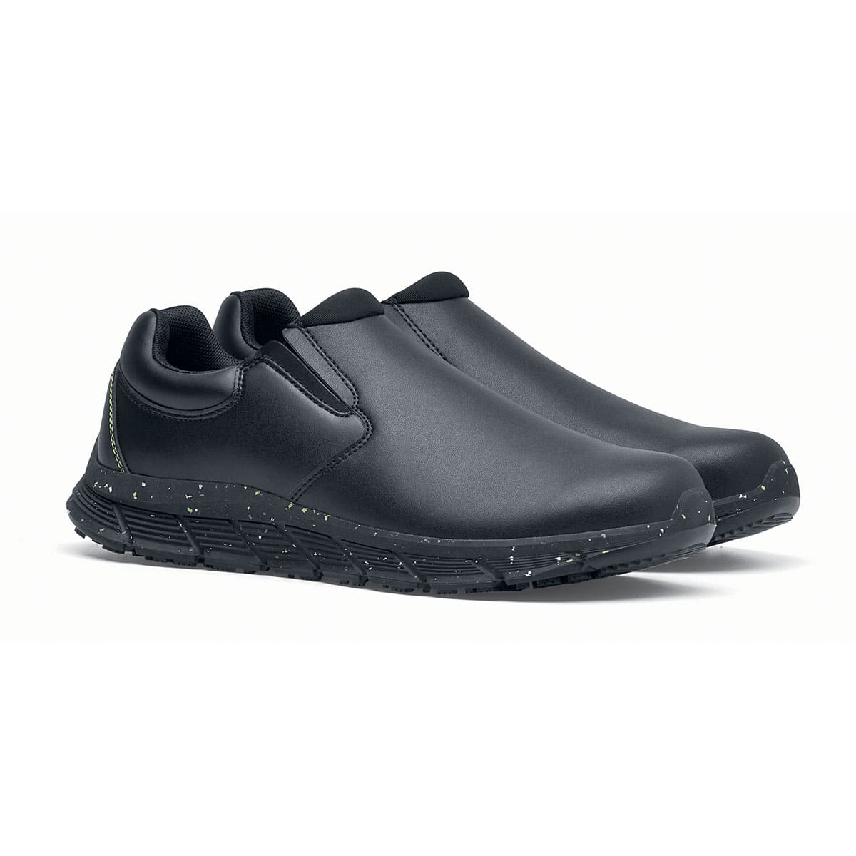 The Shoes for Crews Cater Eco Women's  Black is a sustainable, slip-resistant safety shoe, pair seen in profile on the right.