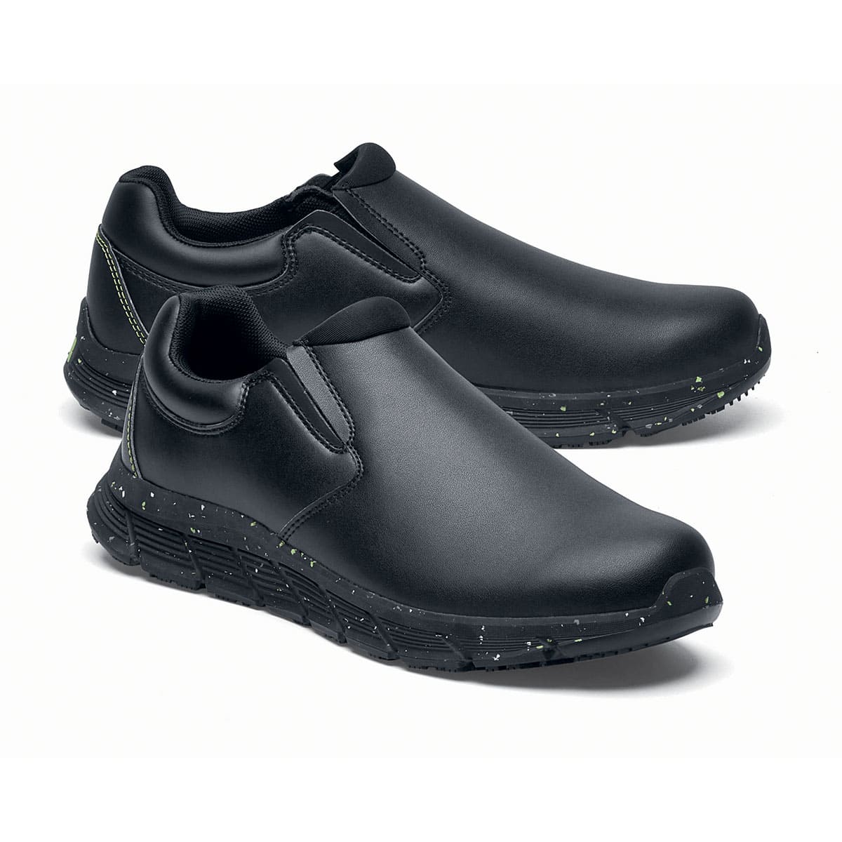 The Shoes for Crews Cater Eco Women's  Black is a sustainable, slip-resistant safety shoe, pair seen from the right side, emphasised on the tip of the right shoe.