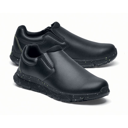 The Shoes for Crews Cater Eco Women's  Black is a sustainable, slip-resistant safety shoe, pair seen from the right side, emphasised on the tip of the right shoe.