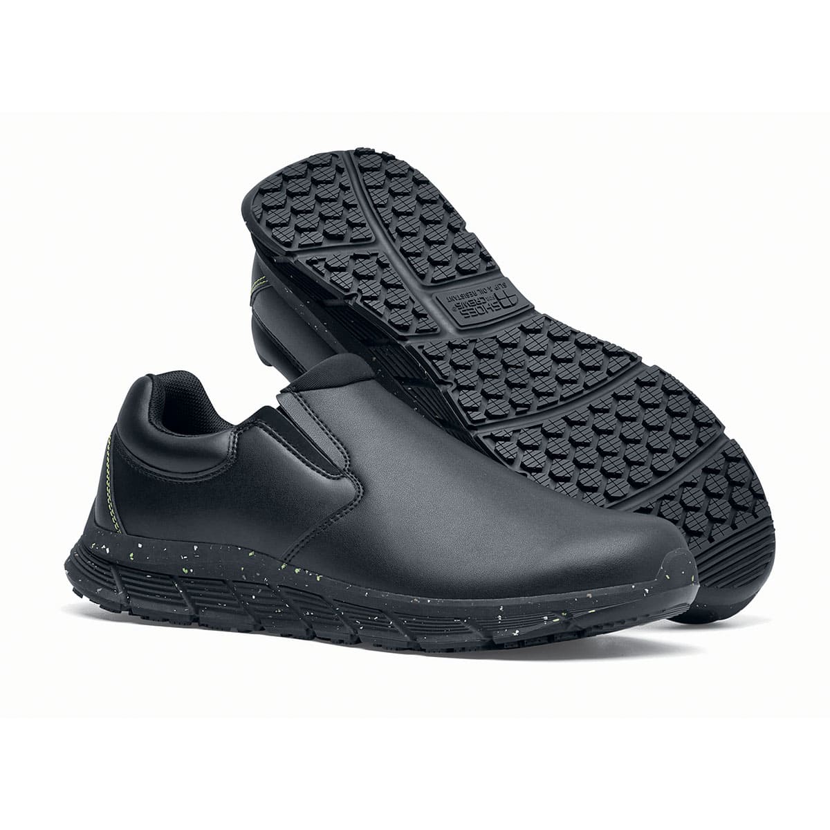 The Shoes for Crews Cater Eco Women's  Black is a sustainable, slip-resistant safety shoe, pair seen from the right side and sole.