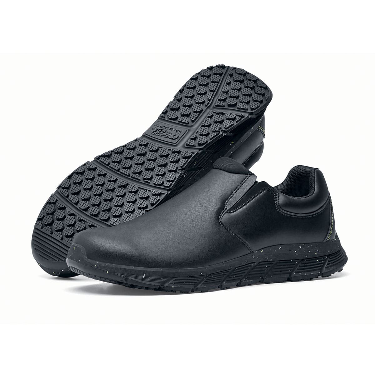 The Shoes for Crews Cater Eco Women's  Black is a sustainable, slip-resistant safety shoe, pair seen from the left  side and sole.