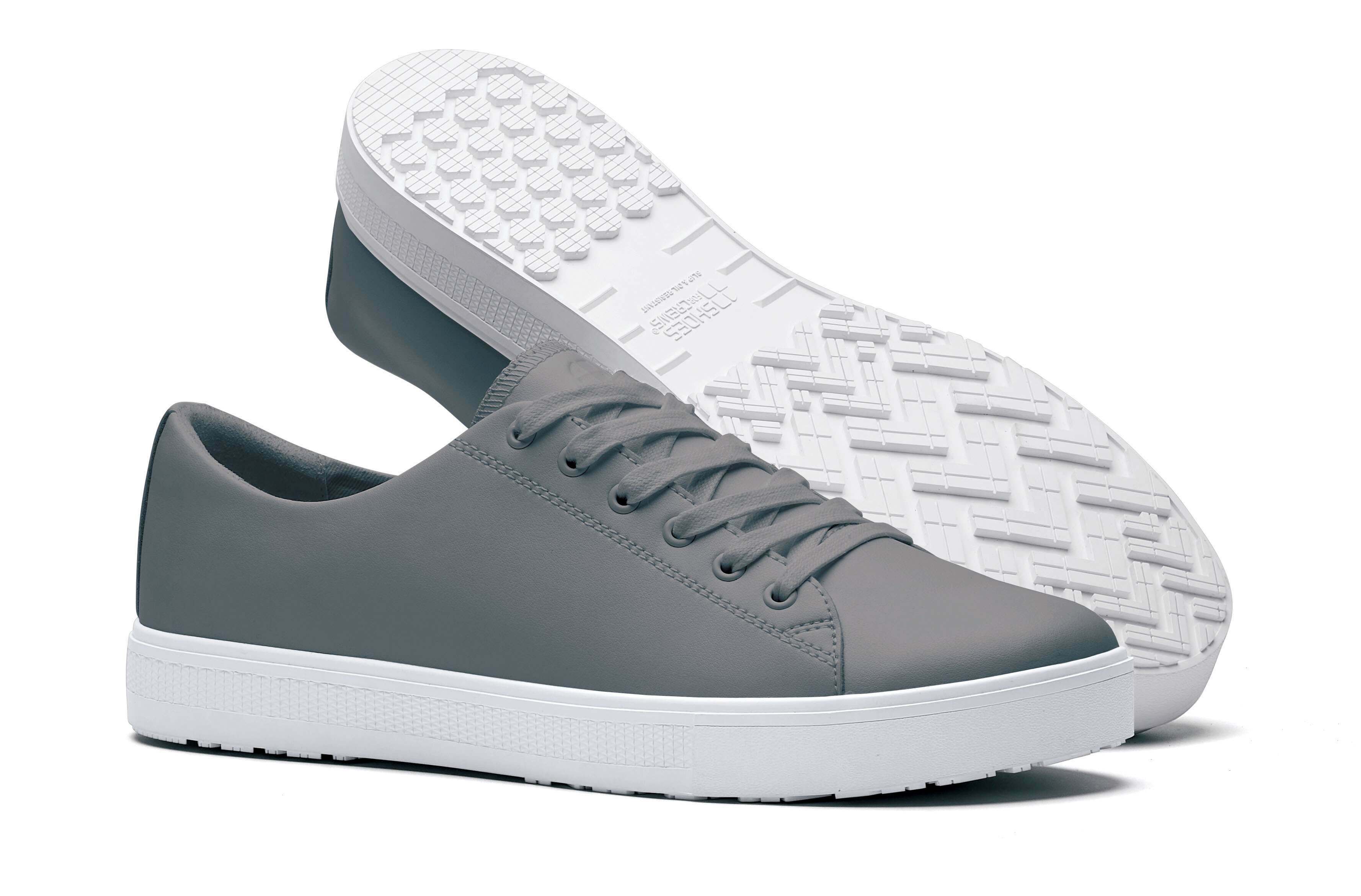 The Old School Low-Rider Wild Dove from Shoes For Crews is a slip resistant lace-up shoe designed to provide comfort throughout the day, pair seen from the left side and the sole.