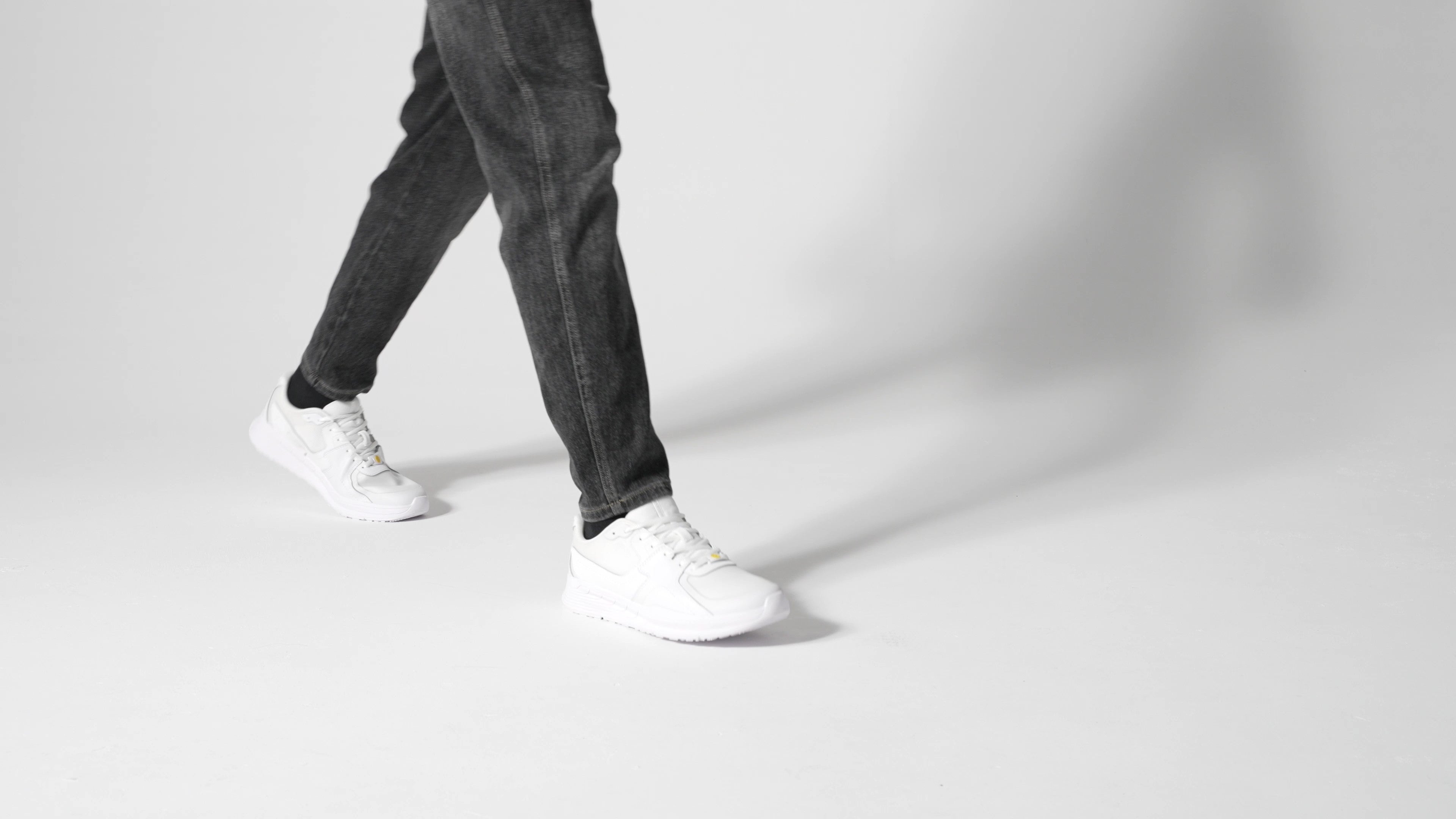 The Shoes for Crews Condor II Unisex White trainers feature a slip-resistant outsole and an easy-to-clean, breathable fabric upper with SpillGuard protection, product video.